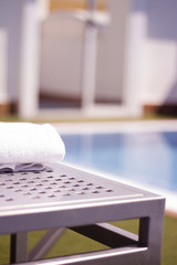 Towel on table in the pool of a luxury hotel