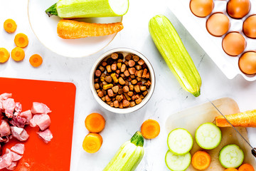 Set of animal food, meat,vegetables and eggs on kitchen top view