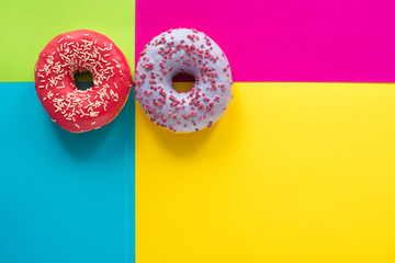 donuts on a beautiful colored background, pastel glamor colors