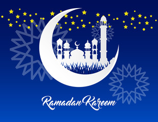 Obraz na płótnie Canvas beautiful ramadan kareem background with paper art style on blue background
