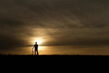 small game hunter in the sunset 