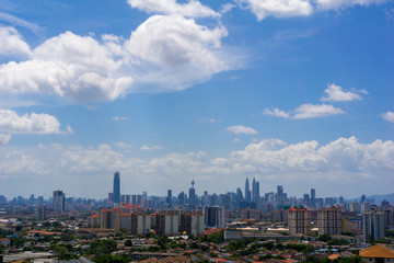 Fototapeta premium A clear and windy day in Kuala Lumpur, capital of Malaysia. Its modern skyline is dominated by the 451m tall KLCC, a pair of glass and steel clad skyscrapers.