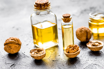 cosmetic and therapeutic walnut oil on dark background
