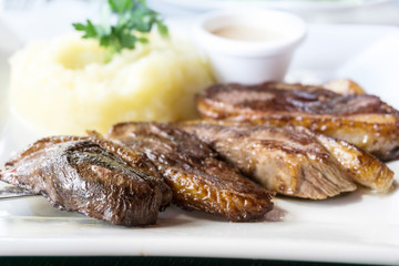 juicy steak veal beef meat with tomato and potatoes