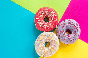donuts on a beautiful colored background, pastel glamor colors