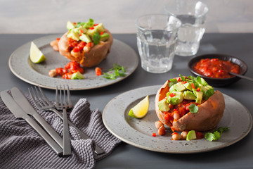 baked sweet potatoes with avocado chili salsa and beans