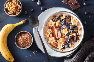 healthy banana smoothie bowl with blueberry chocolate walnuts