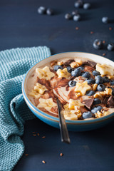 healthy banana smoothie bowl with blueberry chocolate walnuts