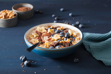 healthy banana smoothie bowl with blueberry chocolate walnuts