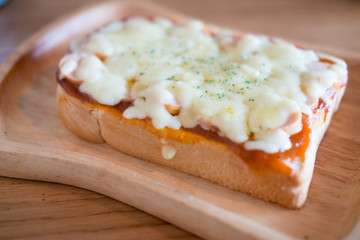 Pizza toasted bread with tomato sauce and ham cheese