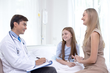 Fototapeta premium Doctor visit to little patient at hospital with happy emotion together. People with health care and medical concept.