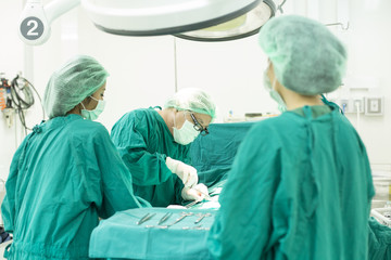 The surgery team working together at the operating room in the hospital.