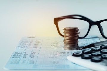 Glasses with bank account passbook for savings financial and accounting concept.
