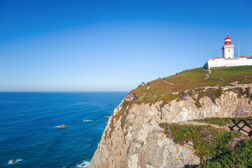 Fototapeta na wymiar Scenic landscape with lighthouse at the Cabo da Roca, a cape which forms the westernmost extent of mainland Portugal