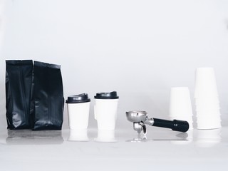 Coffee cup with equipment on white background.