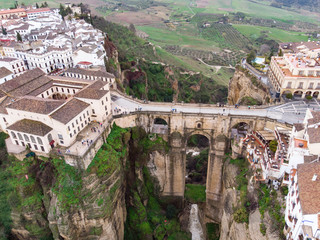 New bridge in Ronda, one of the famous white villages in Andalucia, Spain. Photo from air, March 2018