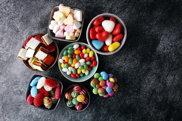 candies with jelly and sugar. colorful array of different childs sweets and treats