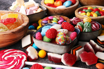 candies with jelly and sugar. colorful array of different childs sweets and treats