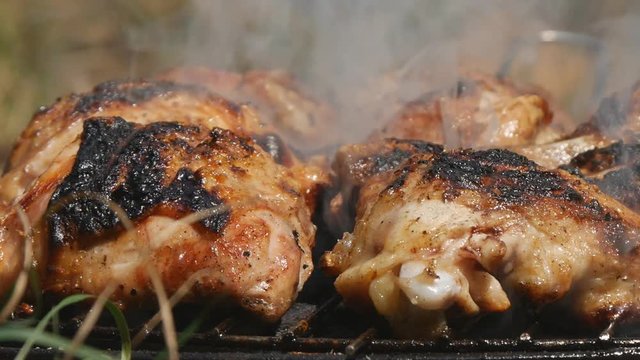 Close Image Pan View with a Roasted and Tasty Chicken Barbecue Grilled