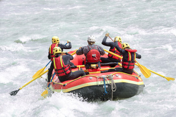 Fototapeta na wymiar Group of people rafting on white water, active vacations, team concept