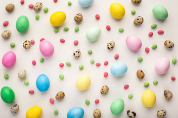 Easter background. Colored eggs on white, isolated