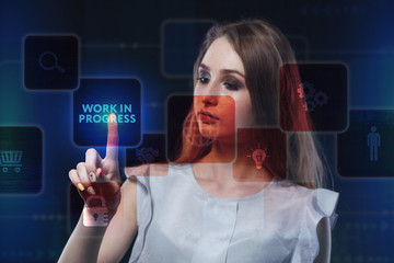 The concept of business, technology, the Internet and the network. A young entrepreneur working on a virtual screen of the future and sees the inscription: Work in progress