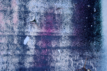 Strong surface structure with rest of blue and violet paint on concrete wall for abstract backgrounds