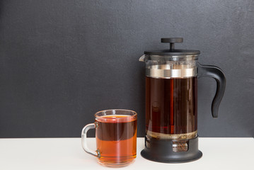 Tea on the table, black background.