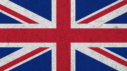 flag of the United Kingdom painted on the wall background. 