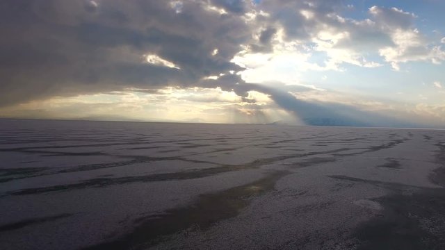 Flying over iced sea or lake by helicopter .