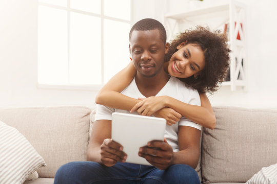 Black Couple Making Using Digital Tablet At Home