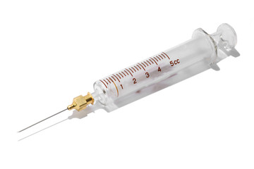 ancient medical syringe made of glass on a white background