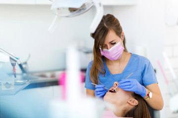 Dentist and patient in dentist office

