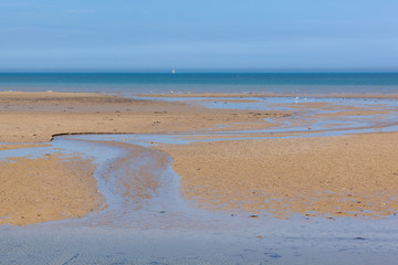 Arromanches-les-Bains beach at low tide in Normandy, France