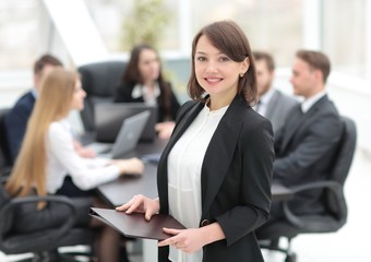 confident young business woman with documents