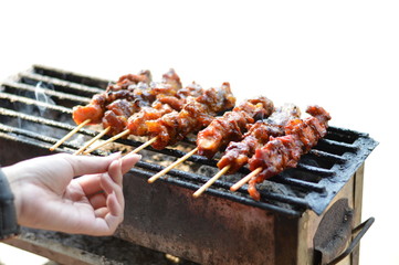 Grilled pork with bamboo stick, Thailand traditional food, They are call "moo-ping".