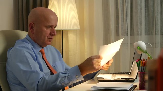 Businessman Read Invoices Verify Payments and Checking Receipts