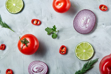 Seamless pattern with red pepper, onion, tomatoes, lime, dill on white background, top view, close-up, selective focus