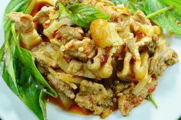 stir fried spicy wild boar and bamboo shoot with red curry on plate