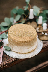wedding decor with a golden cake