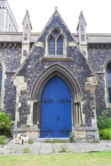 12th century Romanian style Church of St Mary the Virgin,  blue door, Dover, United Kingdom