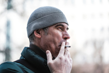 portrait of a man with a cigarette