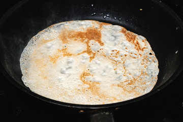 a pancake fried in a skillet