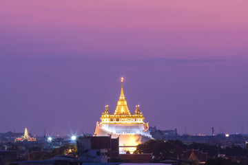 Golden pagoda of Wat Saket Temple in sunset time