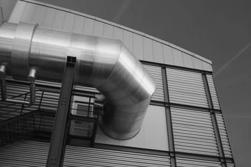 Detail of an industrial hall with aluminum facade, Germany. Black-and-white photography