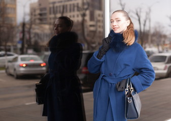  Woman, blue fur coat, handbag, street