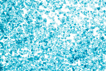 Blue crystals of sea salt on white background