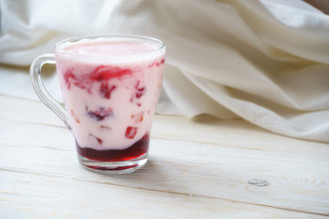 glassful smoothie with yogurt and jam