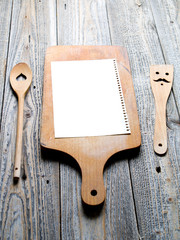 Blank card on a wooden chopping board