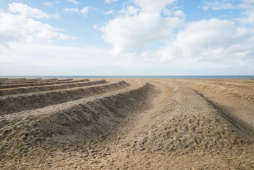 Fototapeta na wymiar Netherlands coast beach desert protective walls